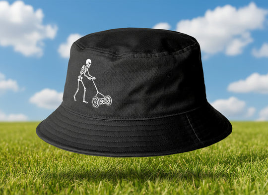 Black bucket hat with a white skeleton design on a light gray background